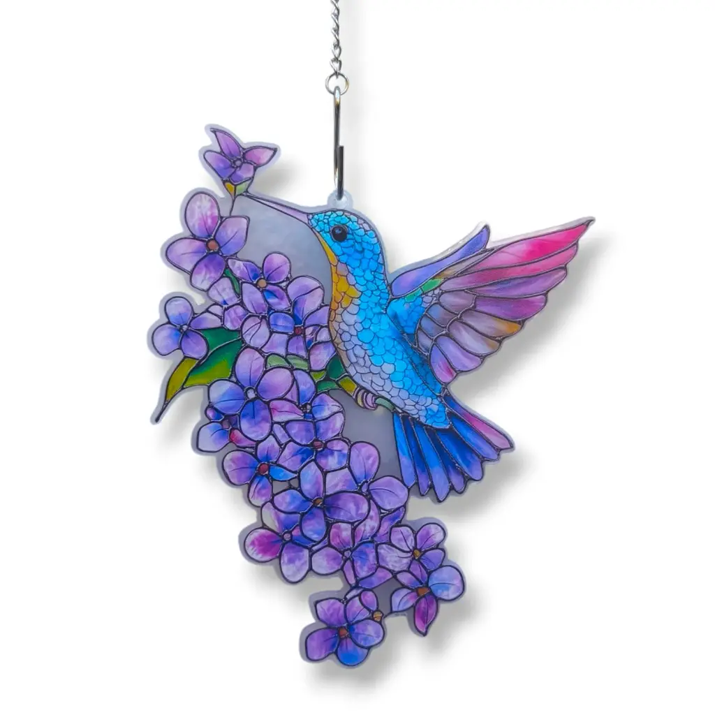 Colibri en flores violetas.webp